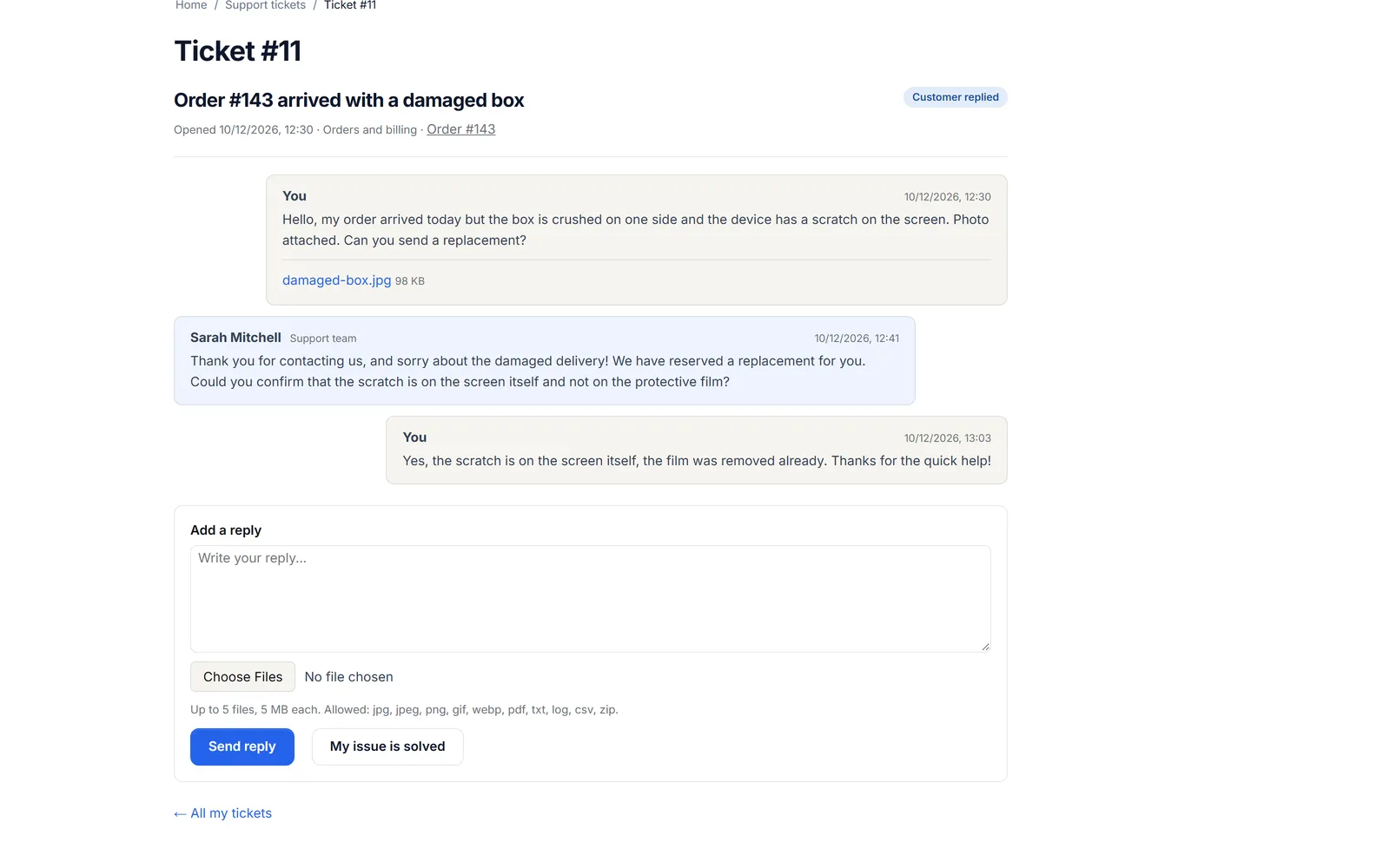 Storefront ticket page: the customer’s message with a photo attachment, the support team’s reply and the customer’s follow-up, with the reply box below.